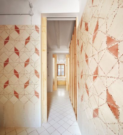 Original tiles are crushed to create a new floor in this Barcelona apartment