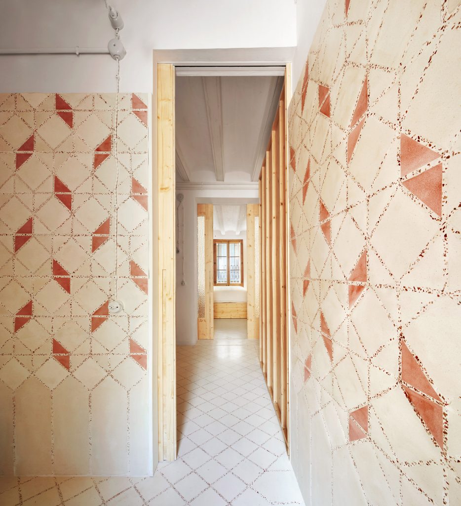 Original tiles are crushed to create a new floor in this Barcelona apartment