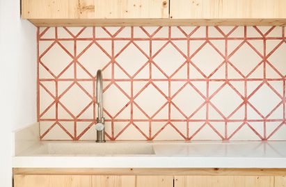 Original tiles are crushed to create a new floor in this Barcelona apartment