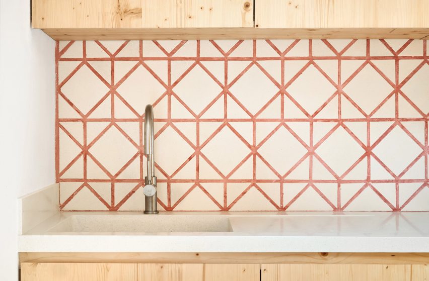Original tiles are crushed to create a new floor in this Barcelona apartment