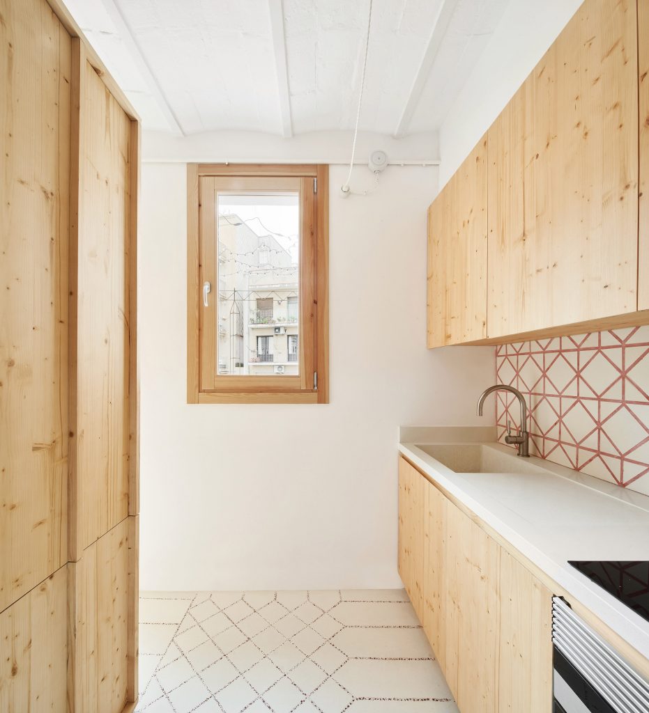 Original tiles are crushed to create a new floor in this Barcelona apartment