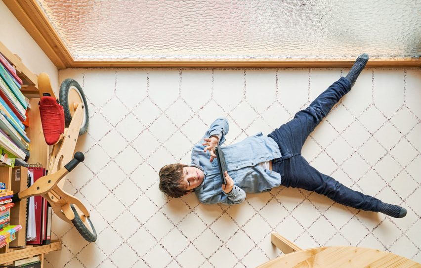 Original tiles are crushed to create a new floor in this Barcelona apartment