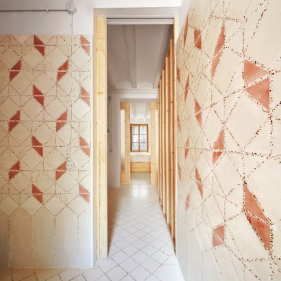 Original tiles are crushed to create a new floor in this Barcelona apartment