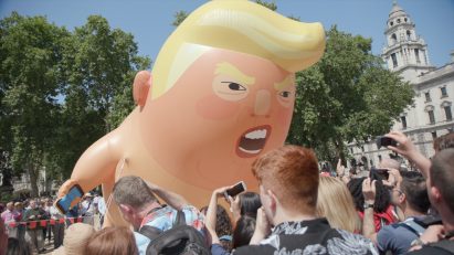 The Trump Baby blimp is an attempt to communicate with the US president "in a language he understands", the graphic designer behind the project claims