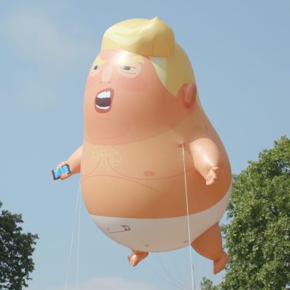 The Trump Baby blimp is an attempt to communicate with the US president "in a language he understands", the graphic designer behind the project claims