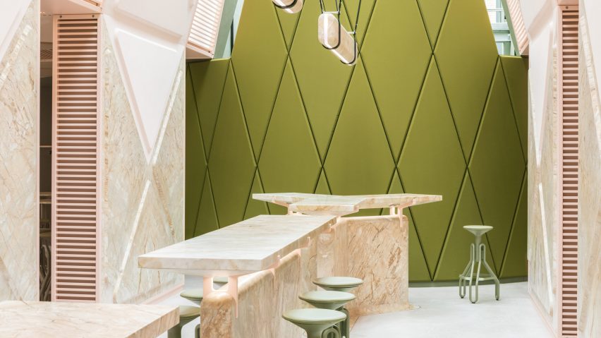 Pink marble surfaces contrast with rich green accents in Ghent’s XYZ Lounge bar