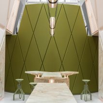 Pink marble surfaces contrast with rich green accents in Ghent’s XYZ Lounge bar