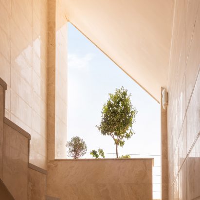 AWE Office creates apartment building with angular stone-clad facade in Iran