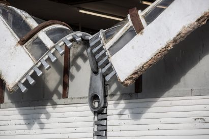Alex Chinneck unzips the walls of a building in latest installation