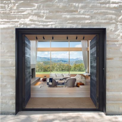 Ridge House by Rowland + Broughton frames views of Rocky Mountains