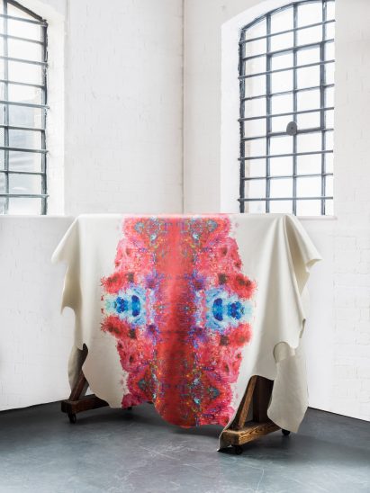 Graphic leather hide by Timorous Beasties features splatters and dribbles of colour