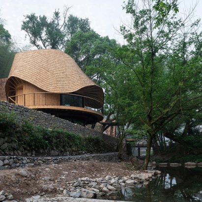 Treewow Retreat is a Chinese village house featuring a round freeform roof
