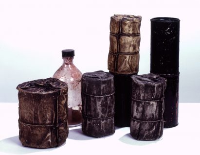 Wrapped Cans and a Bottle by Christo