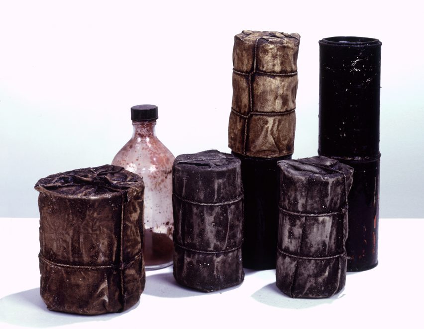 Wrapped Cans and a Bottle by Christo