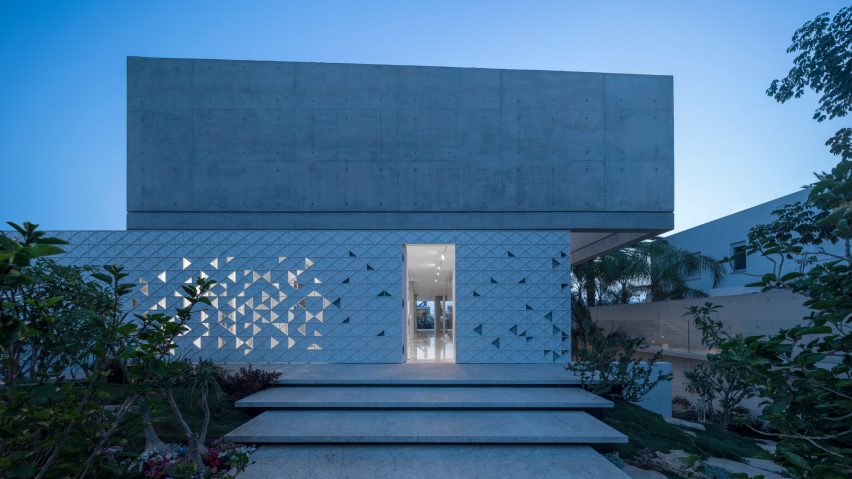 Triangles of light animate perforated aluminium facade of Tel Aviv home by Pitsou Kedem Architects