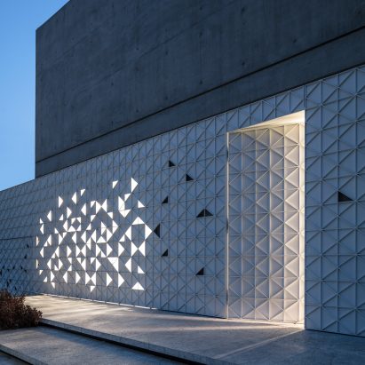Triangles of light animate perforated aluminium facade of Tel Aviv home by Pitsou Kedem Architects