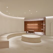 John Pawson uses limestone and cherry wood for minimal Jil Sander shop in Tokyo