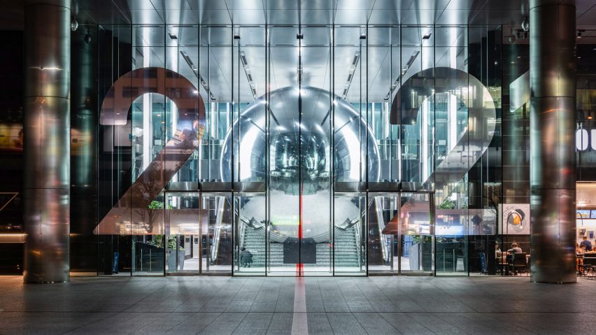 Giant mirrored ball fills staircase of Tokyo office building to encourage the city to think beyond the 2020 Olympics