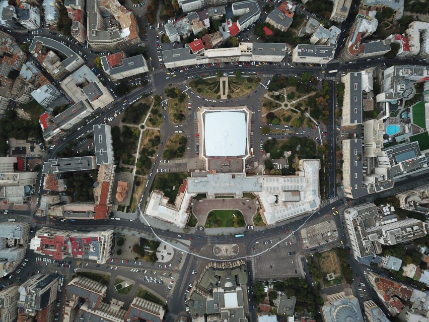 Artist paints impermanent white circle around the Romanian National Museum of Art