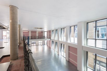 Iridescent turquoise tiles cover Damien Hirst's new flagship studio by Stiff + Trevillion