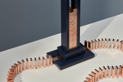 Glithero's interactive lamp is illuminated by a toppling row of dominoes