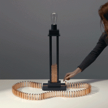 Glithero's interactive lamp is illuminated by a toppling row of dominoes