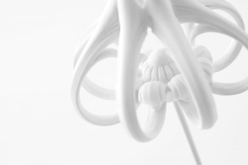 Nendo uses Sèvres porcelain to make flowers from handles and a lilypad table