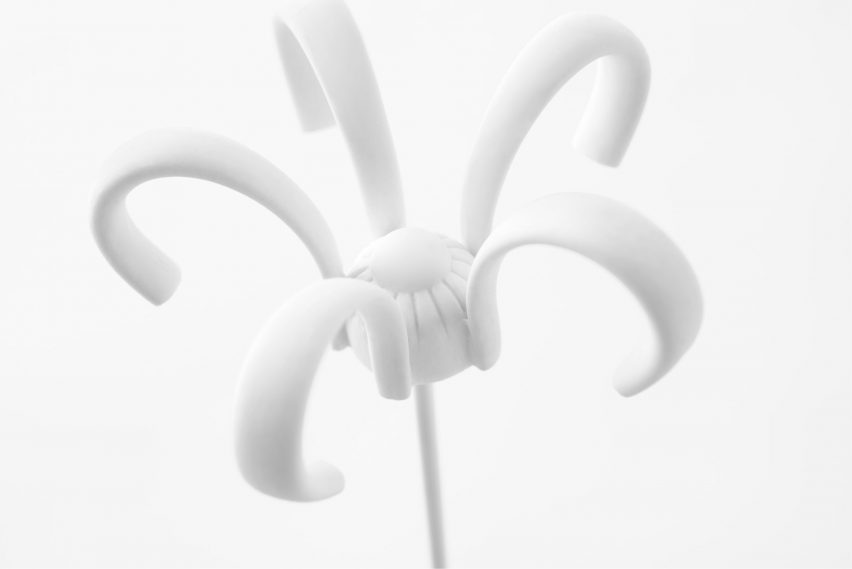 Nendo uses Sèvres porcelain to make flowers from handles and a lilypad table