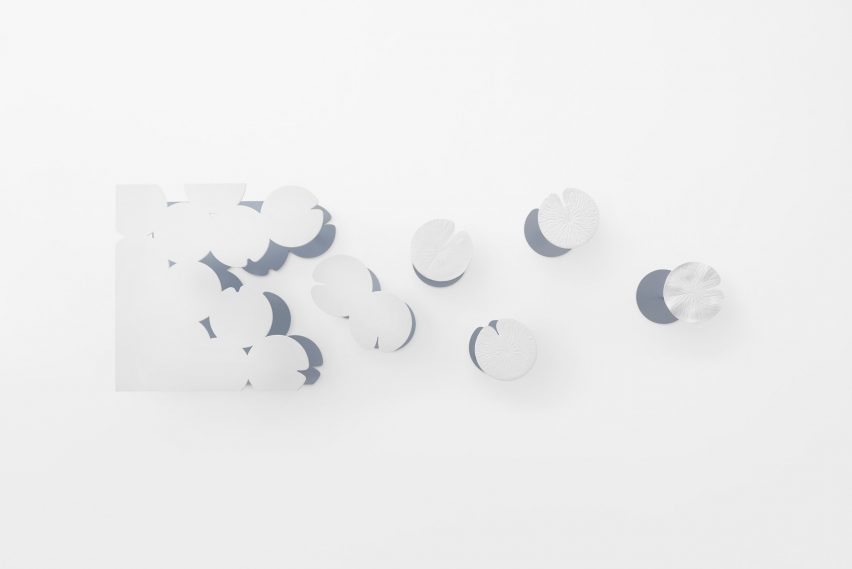 Nendo uses Sèvres porcelain to make flowers from handles and a lilypad table
