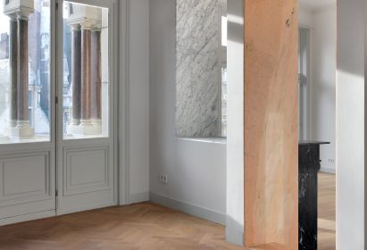 Bovenbouw transforms trio of historic buildings into unique apartments on Antwerp's busiest shopping street