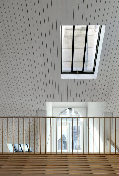 Bovenbouw transforms trio of historic buildings into unique apartments on Antwerp's busiest shopping street