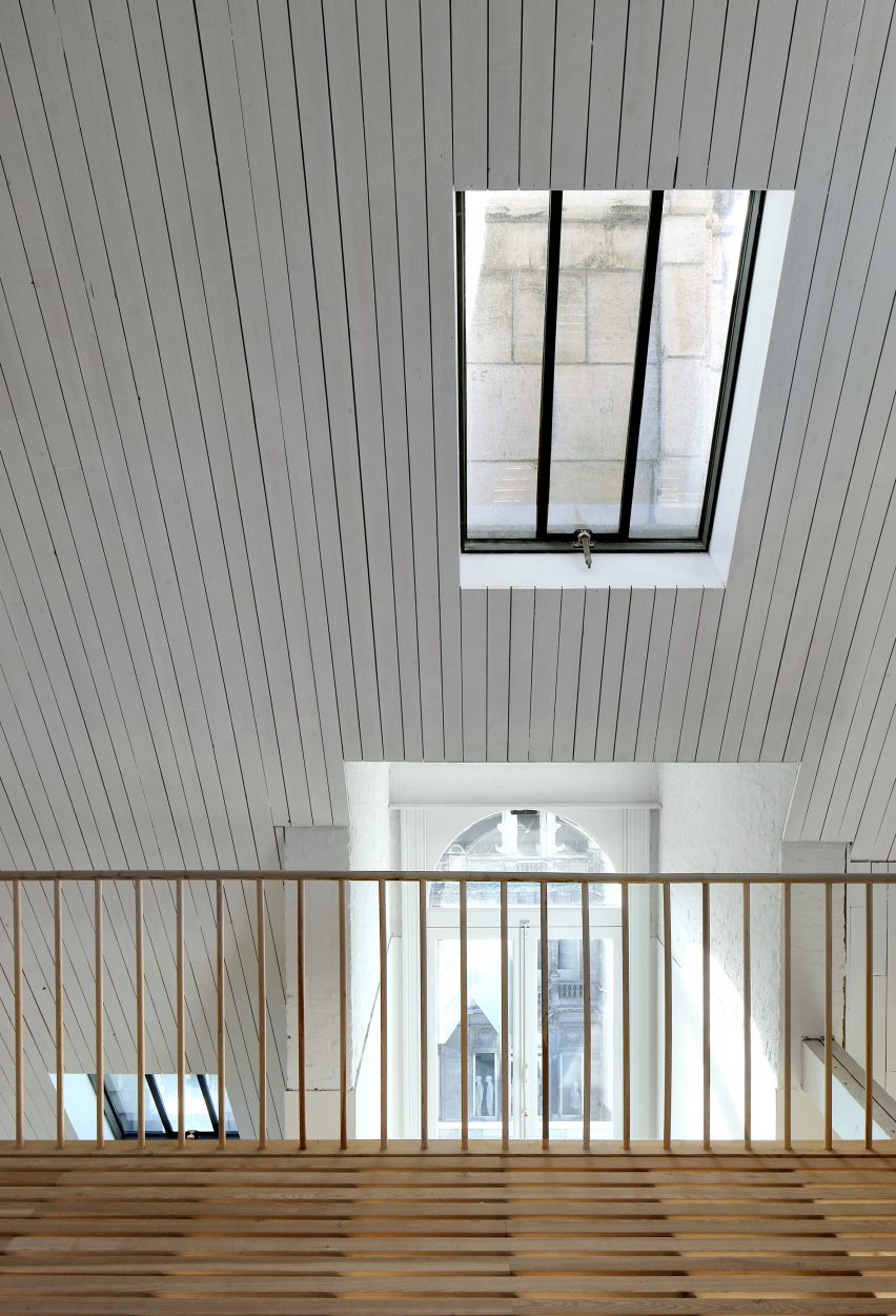 Bovenbouw transforms trio of historic buildings into unique apartments on Antwerp's busiest shopping street