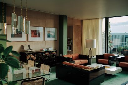 Helios 710 apartment by Bella Freud and Retrouvius with glossy black sofas