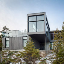 Monochrome ski chalet by Thellend Fortin overlooks Quebec’s Saint Lawrence River