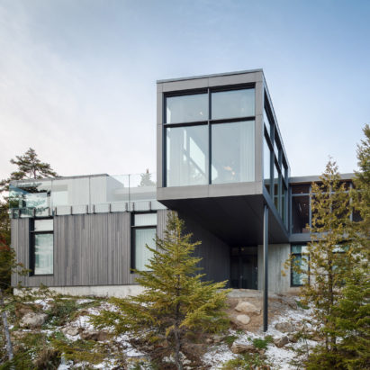 Monochrome ski chalet by Thellend Fortin overlooks Quebec’s Saint Lawrence River