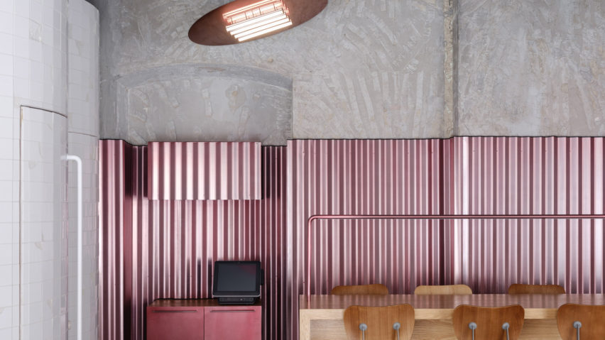 Ridged panels of pink metal appear throughout Moscow’s Rare Pastrami Bar