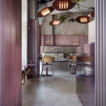 Ridged panels of pink metal appear throughout Moscow’s Rare Pastrami Bar