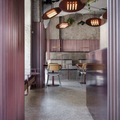 Ridged panels of pink metal appear throughout Moscow’s Rare Pastrami Bar