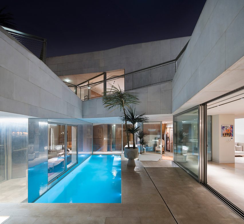AGi Architects' Rock House features "origami-like" stone facades