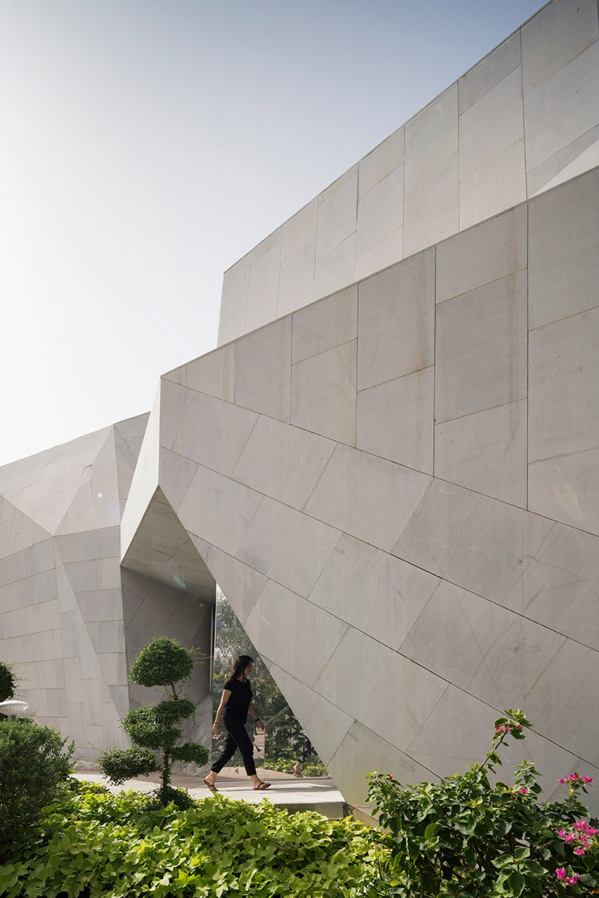 AGi Architects' Rock House features "origami-like" stone facades
