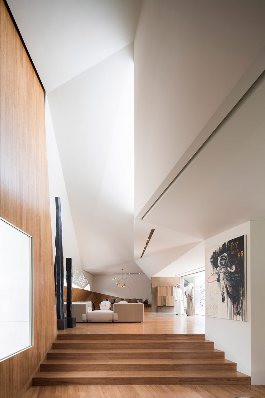 AGi Architects' Rock House features "origami-like" stone facades