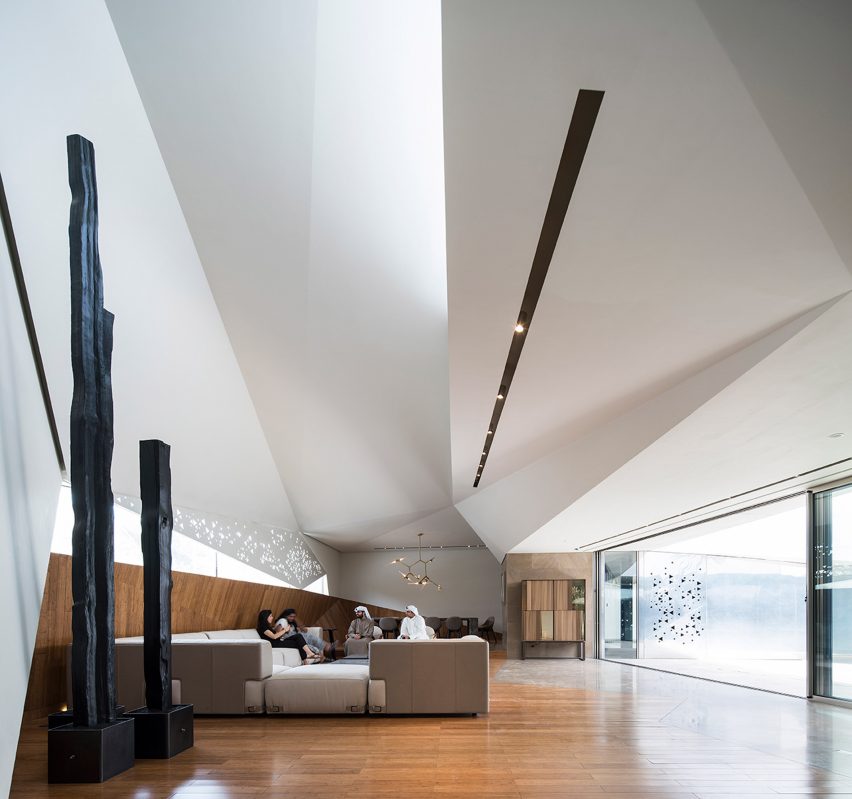 AGi Architects' Rock House features "origami-like" stone facades