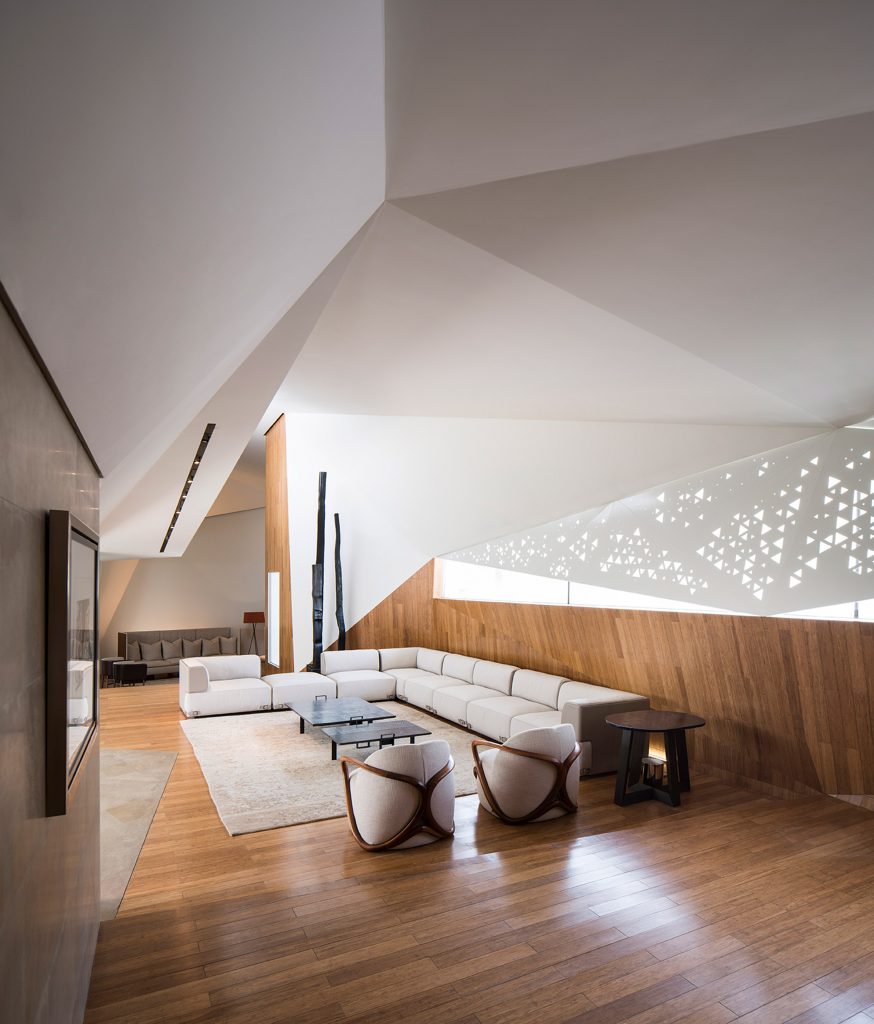 AGi Architects' Rock House features "origami-like" stone facades