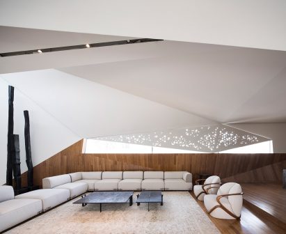 AGi Architects' Rock House features "origami-like" stone facades