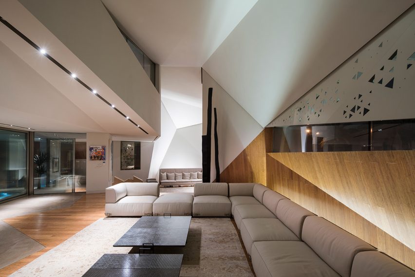 AGi Architects' Rock House features "origami-like" stone facades
