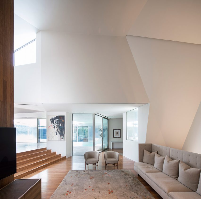 AGi Architects' Rock House features "origami-like" stone facades