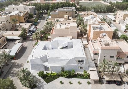 AGi Architects' Rock House features "origami-like" stone facades