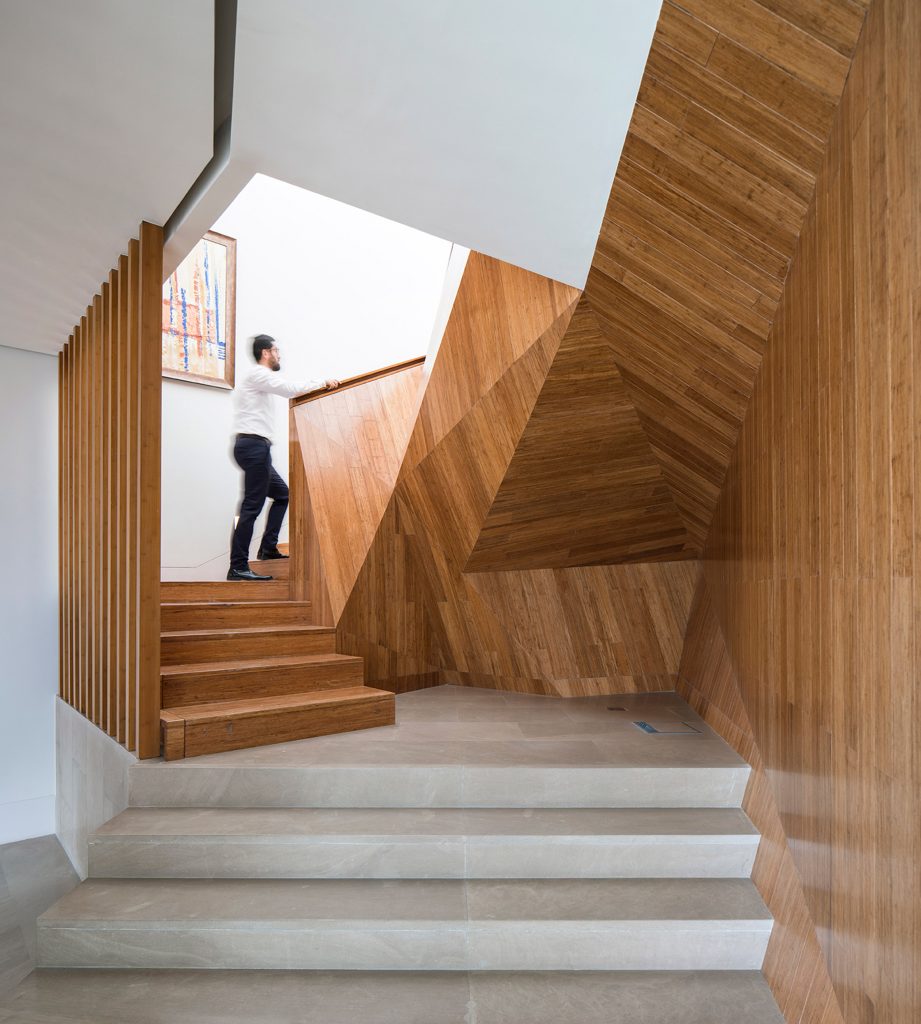 AGi Architects' Rock House features "origami-like" stone facades