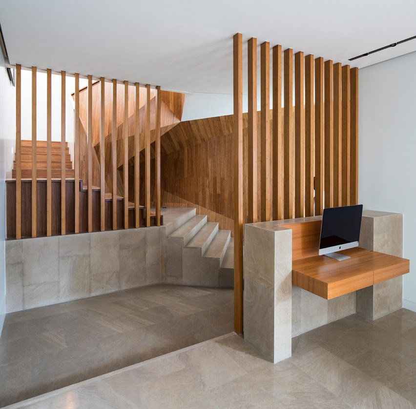 AGi Architects' Rock House features "origami-like" stone facades