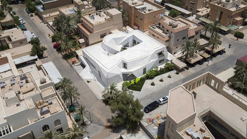 AGi Architects' Rock House features "origami-like" stone facades